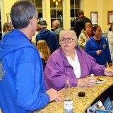 Lemoore's Connie Wlaschin enjoys her conversation with Ray Etchegoin Saturday night at the annual Toys for Tots gathering.